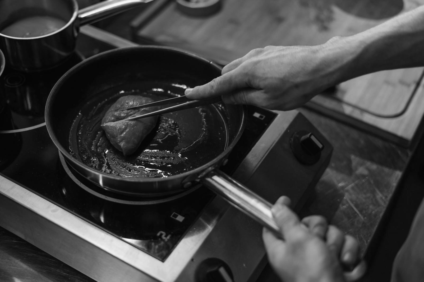 Plated vegan dish with artistic presentation and garnishes on rustic table